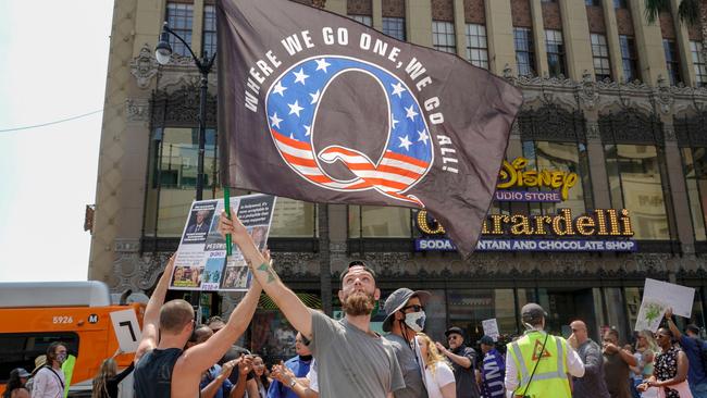 QAnon demonstrators protest child trafficking on Hollywood Boulevard in Los Angeles last year. Group members tend to avoid talking openly. Picture: AFP