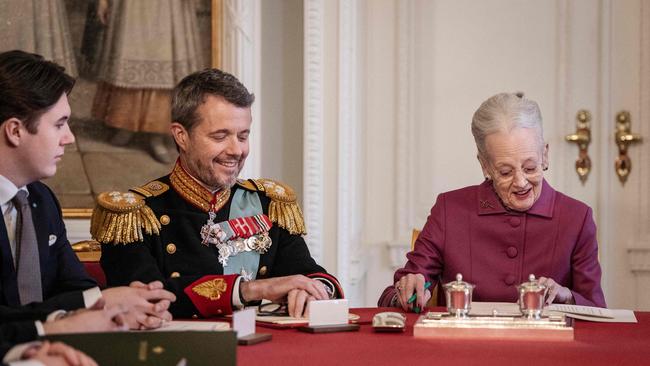 Queen Margrethe II of Denmark signs a declaration of abdication as Crown Prince Frederik of Denmark becomes King Frederik X of Denmark and Prince Christian. Picture: AFP