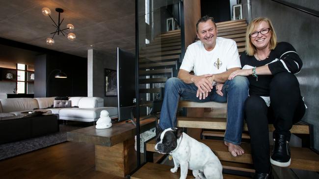 Ros and Todd Lyons with their French bulldog, Tux, at their home on the NSW central coast. Picture: Liam Driver