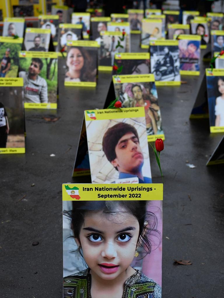 Protesters in France place portraits of victims of Iran's repression. Picture: Julien de Rosa/AFP