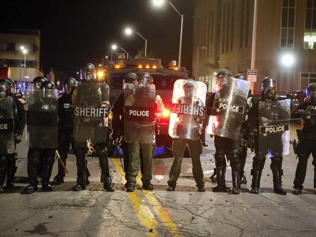 Police form a line across a street during a protest in Des Moines, Iowa. Picture: Bryon Houlgrave/The Des Moines Register via AP