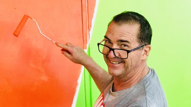 Bruce Devereaux picked up a paintbrush to help paint a large piece of artwork on a wall in Mary Street.