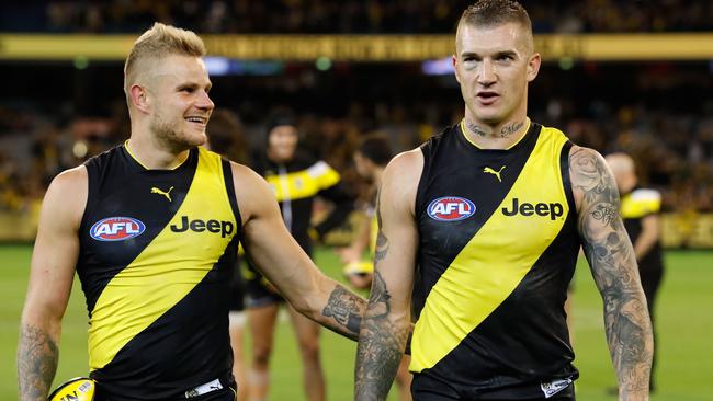 Ellis enjoying a win with Dustin Martin. Picture: Getty Images