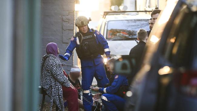 Police raid a house in Surry Hills yesterday. Picture: Dylan Robinson