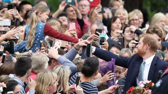 The prince makes a connection with a young fan. Picture: AAP