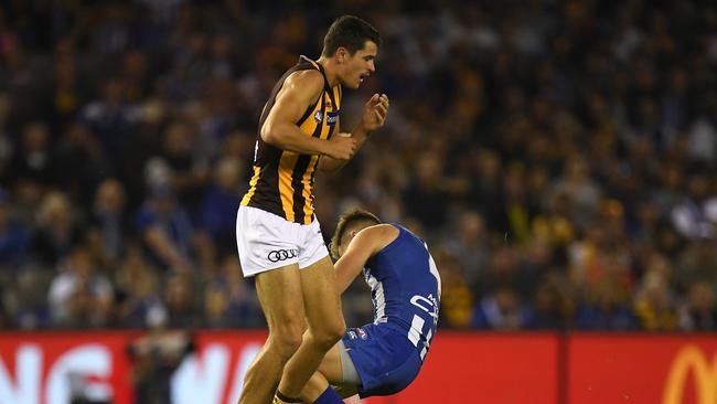 Ryan Burton knocks out Shaun Higgins with a heavy bump. Picture: AAP