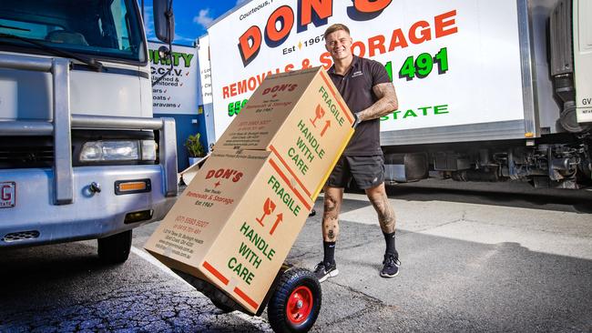 Gold Coast high school dropout Cory Still now runs his family's removal business – Dons Removals and Storage. He also owns a cafe, and two homes. Photo: Nigel Hallett.