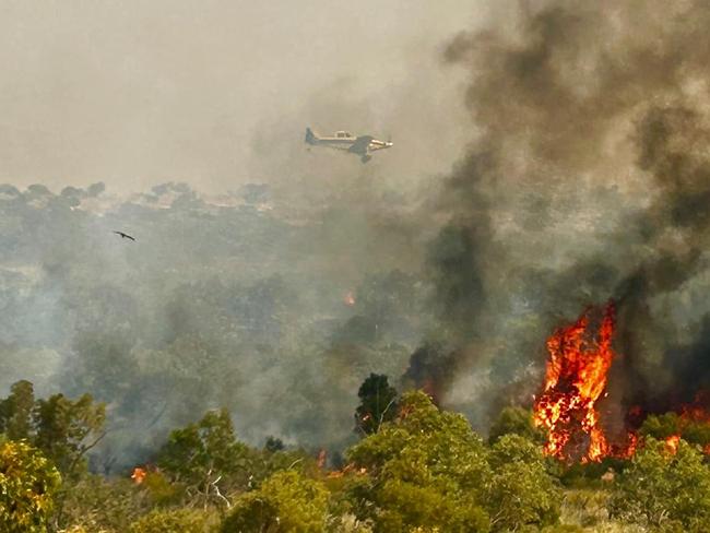 Efsta Konidaris Photography captured images of water bombers helping to douse the Tennant Creek bushfires at Battery Hill. Photos: Efsta Konidaris Photography