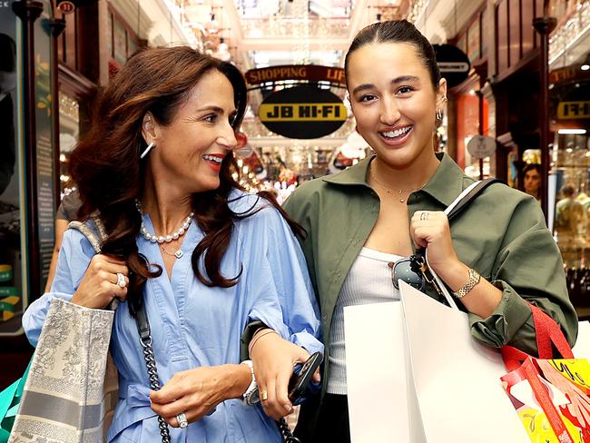 Christmas shoppers Natasha Colli with her daughter Javita (21) in The Strand Arcade, Sydney. Data showing that people are returning to bricks and mortar stores to do their Christmas shopping over online retail.Inflation and rising interest rates are also contributing a more modest spend this year. Jane Dempster/The Australian.