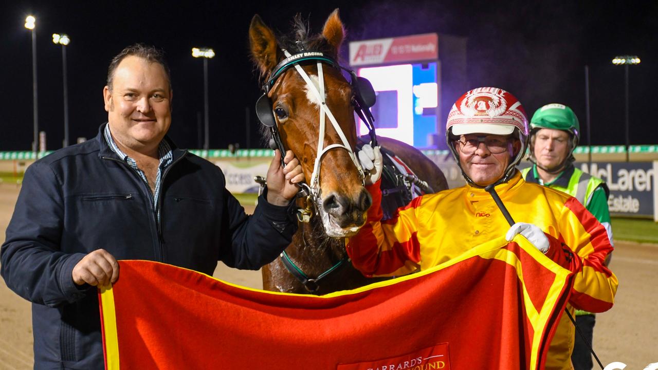 Trainer Brent Lilley and driver Chris Alford with Queen Elida. Picture: HRNSW,