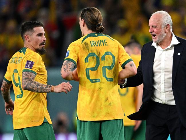 AL WAKRAH, QATAR - NOVEMBER 30: Graham Arnold, Head Coach of Australia, celebrates with Jamie MacLaren and Jackson Irvine of Australia after the 1-0 victory in the FIFA World Cup Qatar 2022 Group D match between Australia and Denmark at Al Janoub Stadium on November 30, 2022 in Al Wakrah, Qatar. (Photo by Stuart Franklin/Getty Images)