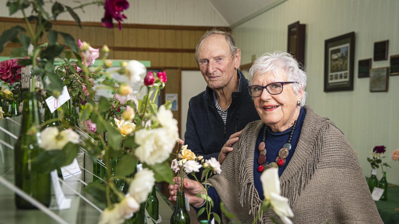 Henry and Jane Bracey admire the Queensland Rose Society Darling Dows Group autumn show roses, Saturday, May 4, 2024. Picture: Kevin Farmer