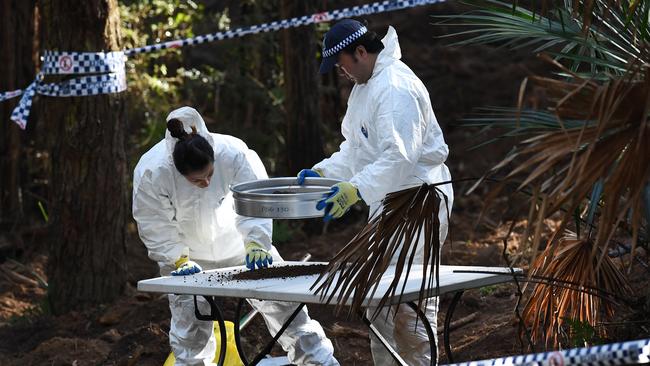 NSW Police Force’s forensics officers sift through dirt as they begin to exhume Matthew Leveson’s remains.