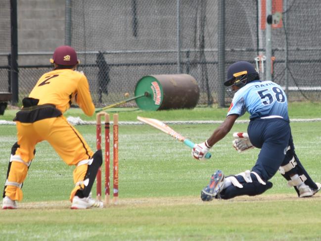 UNSW keeper Fletcher Gersbach tries to stump Evan David. Picture: Sean Teuma