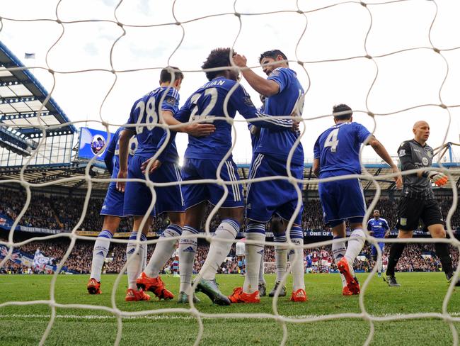 Diego Costa celebrates with teammates after scoring Chelsea’s first goal against Aston Villa.