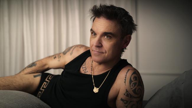 Robbie Williams spends almost all of the four hours ‘narrating’ his Netflix special dressed only in his jocks and a singlet, writes Helen Trinca. Picture: Netflix