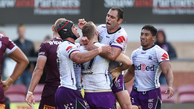 Storm players celebrate Tom Eisenhuth’s try in Round 1 against Manly.