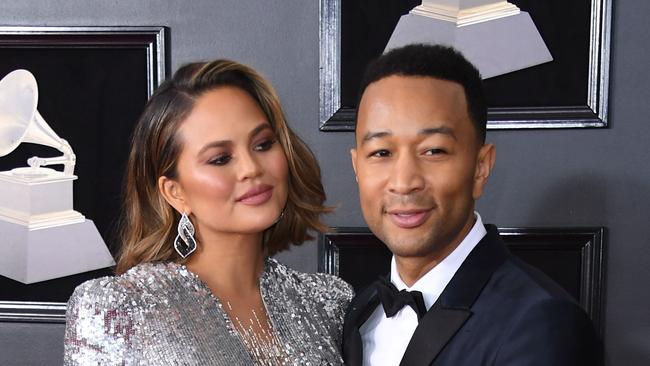 Chrissy Teigen and John Legend arrive for the 60th Grammy Awards.