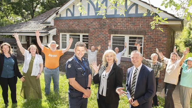 Community members celebrate after the former Warrandyte police station was retained for use as emergency housing. Picture: Ellen Smith