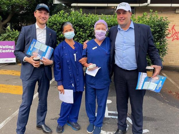 Liberal MP for Mackellar Jason Falinski (right) with LIberal Senator James Paterson (left ) with two voters at the Warriewood pre-poll centre on Tuesday. Mr Fainski said Simon Holmes a Court is trying to take over the parliament with money. Picture: Facebook (Jason Falinski)