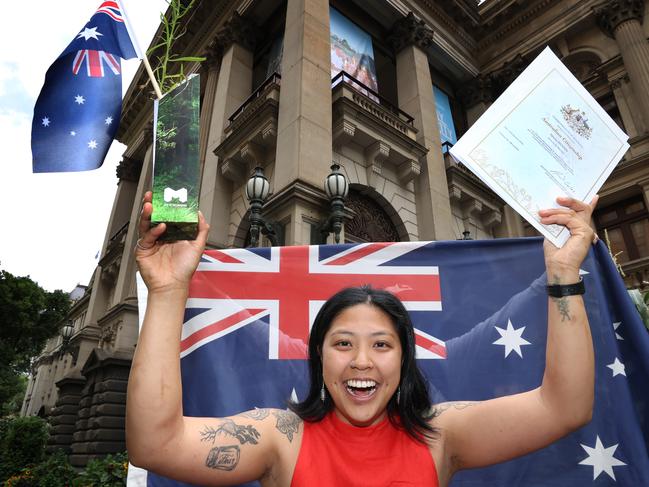 Eighty-one councils are now refusing to hold citizenship ceremonies on Australia Day, despite people like VyVyan Huynh celebrating outside Melbourne Town Hall last year. Picture: David Caird