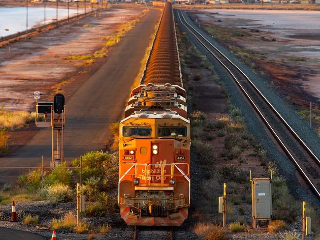 A BHP freight train carrying Australian iron ore to port. Australia ships around a third of its overall exports to China. PHOTO: IAN WALDIE/BLOOMBERG NEWS