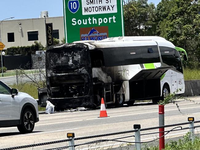 Emergency services on the scene of a bus fire southbound on the M1 at Helensvale. Photo: Peter Wallis.