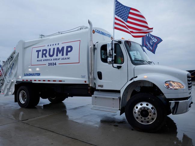 The garbage truck decked out with campaign signs and flags. Picture: Chip Somodevilla/Getty Images/AFP