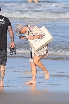 Pink stung by blue bottles on Gold Coast beach