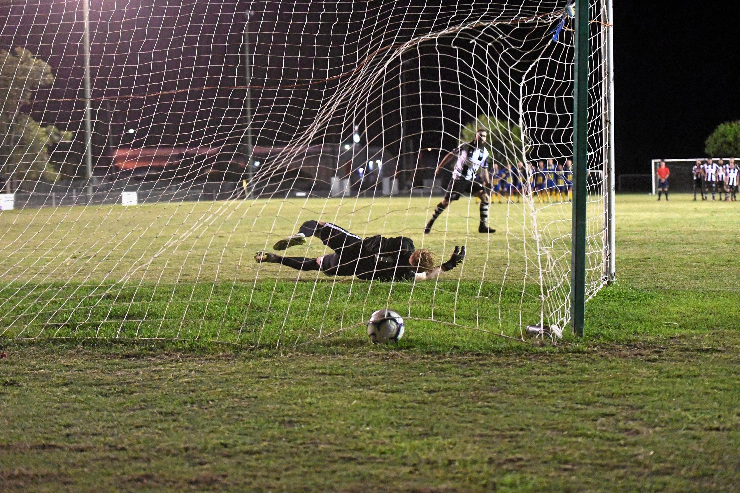 Bingera's Robert Cull scores his penalty in the final. Picture: Shane Jones