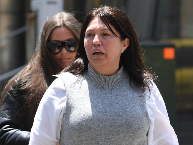 Roberta Williams (right) and her daughter Dhakota arrive at the Supreme Court in Melbourne, Friday, December 14, 2018. Gangland widow Roberta Williams is set to find out if a last-ditch bid to save the family's home from auction on Saturday is successful. (AAP Image/Julian Smith) NO ARCHIVING