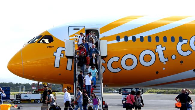 The Scoot Dreamliner aircraft touching down at Gold Coast Airport for the first time on its way to Singapore in 2015. The flight route has now been suspended. Picture: David Clark