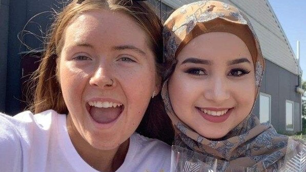 Ruqia Haidari, right, with her best friend, Abbey Gawne, left, in a picture taken during their graduation at McGuire College in Shepparton two months before Ms Haidari was killed in January 2020.