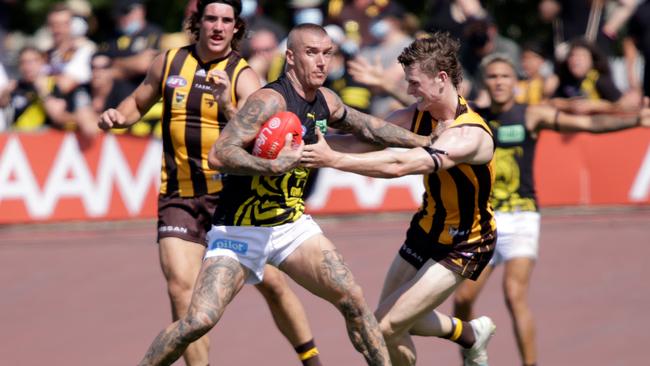 Dustin Martin fends off Ned Long during a pre-season clash.