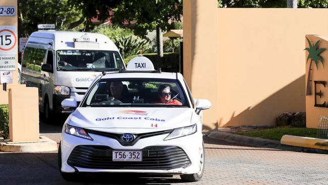 Taxis ferry people out of Earle Haven (AAP Image/Tim Marsden)