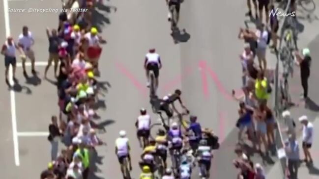 Idiotic spectator causes huge crash at Tour de France | Herald Sun