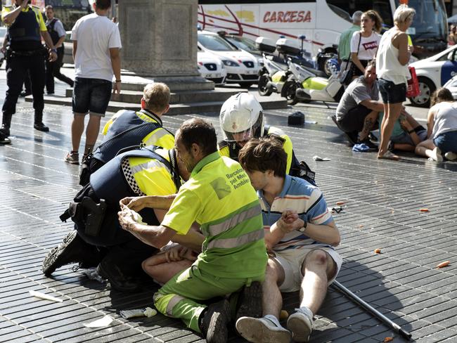 Police and medical personnel attend to injured after the attack at Las Ramblas. Picture: Getty