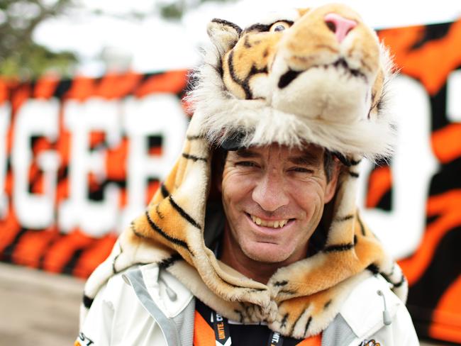 A Tigers fan gets into the spirit of the game. Photo: Brett Costello