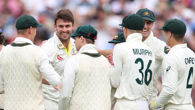 The Aussies celebrate the wicket of Ben Duckett. (Photo by Ryan Pierse/Getty Images)