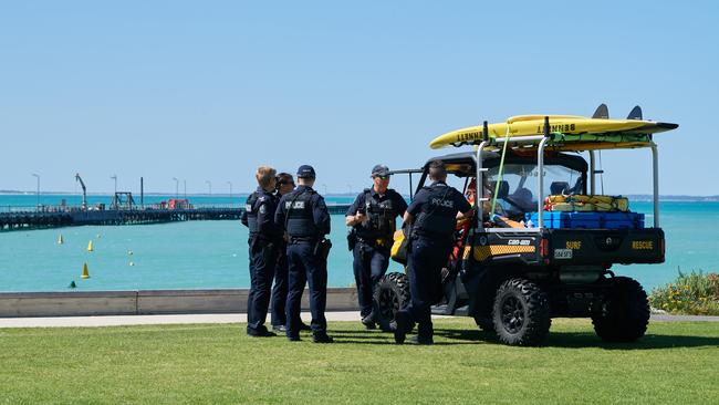 Police at Beachport jetty after a shark bit local swimmer Pam Cook. Picture: Frank Monger