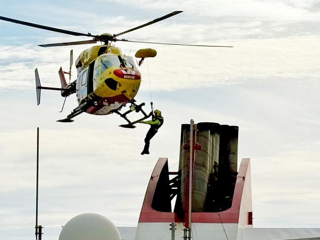 Tasmania Police personnel fast-roping from the Westpac Rescue Helicopter during a training exercise on the Spirit of Tasmania II in Devonport. Picture: Simon McGuire.