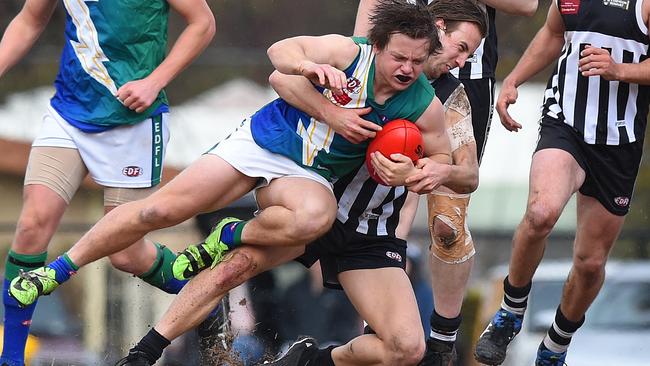 East Sunbury's Shane Lindsay is tackled by Moonee Valley's Stuart Aberdein. Picture: Josie Hayden