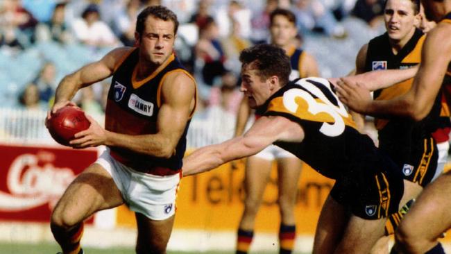 Tony McGuinness, in action for Adelaide in 1993, played 113 AFL games for the Crows.