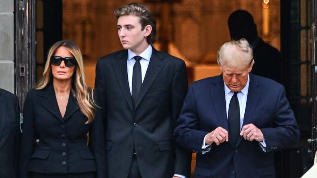 Donald Trump with his wife Melania and son Barron at the funeral for Mrs Trump’s mother, Amalija Knavs, in Florida in January 18. Picture: AFP