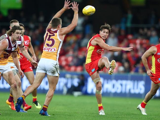 David Swallow of the Suns kicks during the round 22 AFL match between the Gold Coast Suns and Brisbane Lions at Metricon Stadium on August 18, 2018 in Gold Coast, Australia. Picture: Chris Hyde/Getty Images.