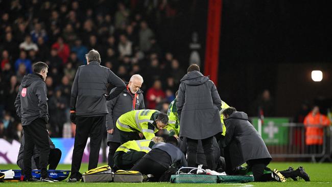 BOURNEMOUTH, ENGLAND - DECEMBER 16: Tom Lockyer of Luton Town (obscured) receives medical treatment after collapsing during the Premier League match between AFC Bournemouth and Luton Town at Vitality Stadium on December 16, 2023 in Bournemouth, England. (Photo by Mike Hewitt/Getty Images)