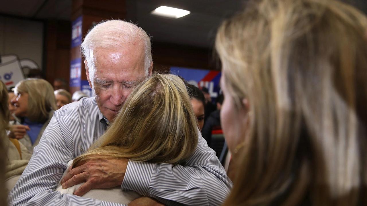 Biden hugging a voter at a campaign event in New Hampshire in 2020. Picture: Getty