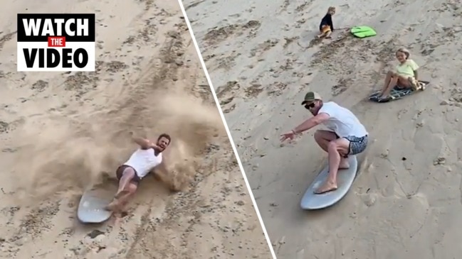 WATCH NOW: Hemsworth brothers battle it out on Queensland sand dunes