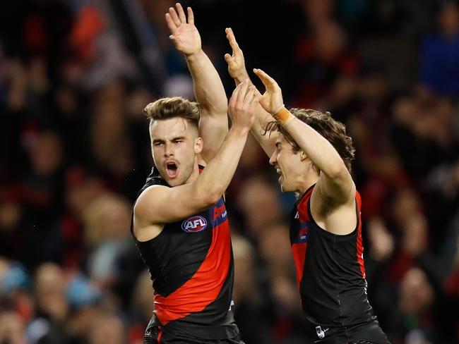 MELBOURNE, AUSTRALIA - AUGUST 03: Will Snelling (left) and Andrew McGrath of the Bombers celebrate during the 2019 AFL round 20 match between the Essendon Bombers and the Port Adelaide Power at Marvel Stadium on August 03, 2019 in Melbourne, Australia. (Photo by Michael Willson/AFL Photos via Getty Images)