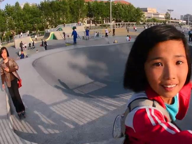 A North Korean girl is seen skating in the North Korean capital of Pyongyang in a time-lapse video of the city by filmmakers Rob Whitworth and JT Singh. Picture: Rob Whitworth and JT Singh/National Geographic